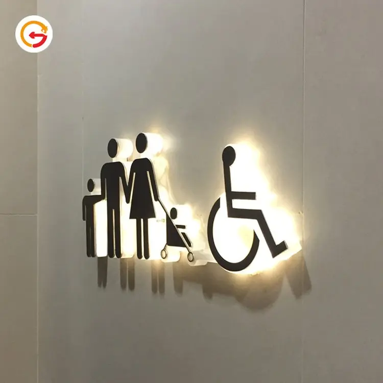 Hinterleuchtete Familien- und Barrierefreiheits-Piktogramme an einer hellen Wand